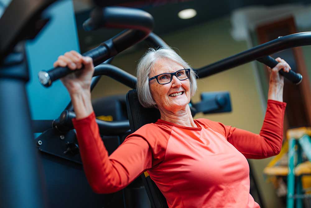 woman using exercise machine