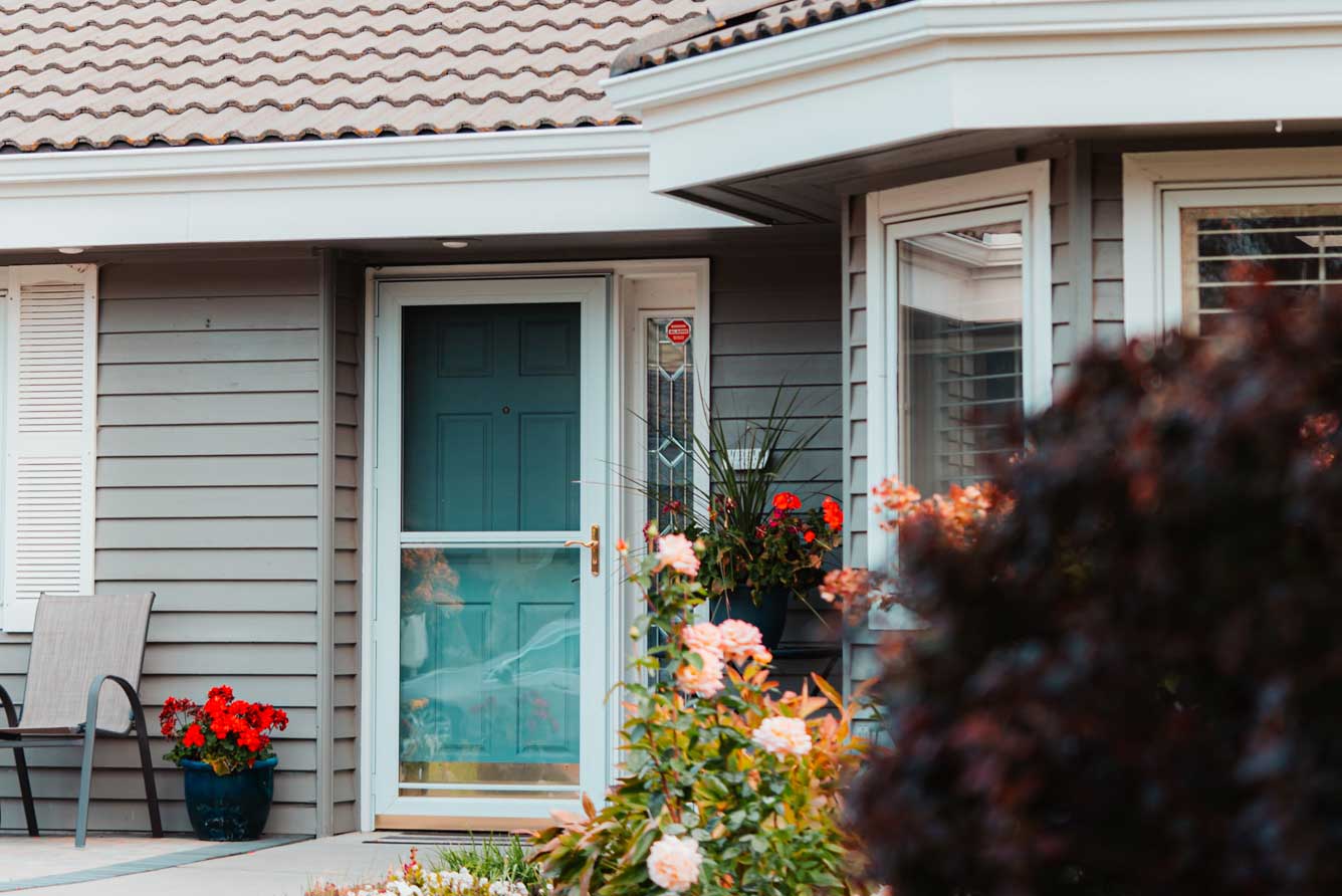 front door with flowers