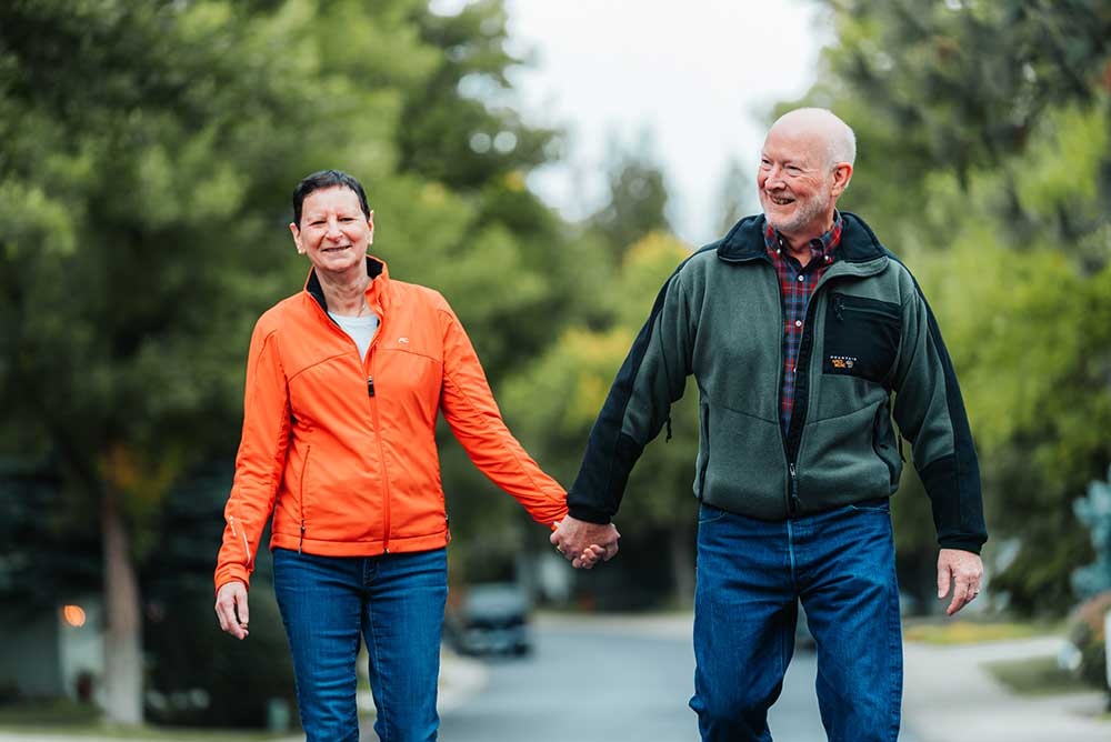 Couple walking down the street holding hands