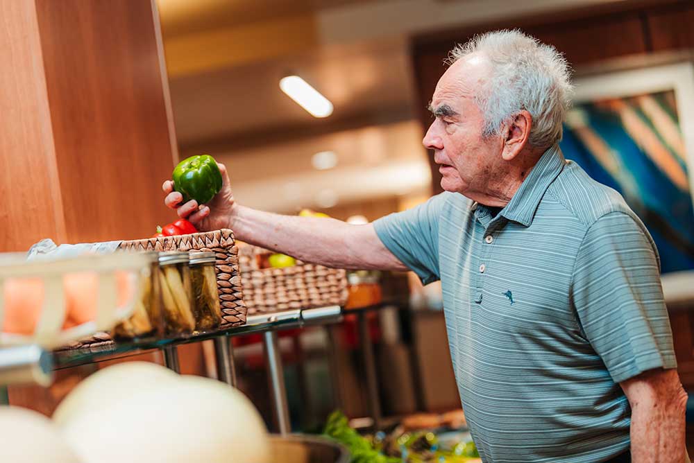 man holding a pepper