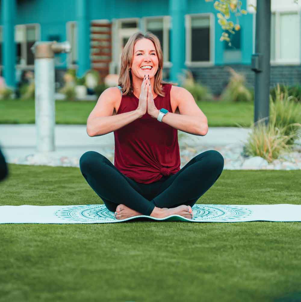 Woman practicing yoga in a park