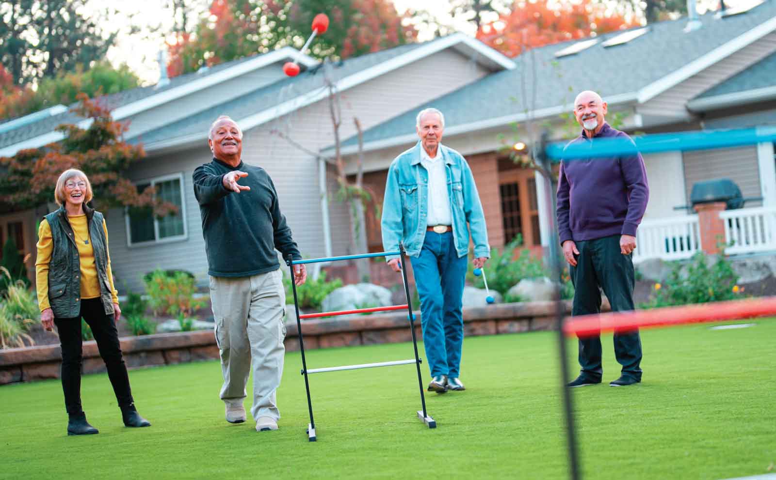 A group of senior adults play an outdoor game