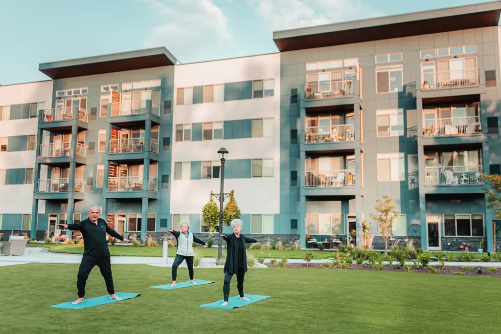 Senior adults practice outdoor yoga